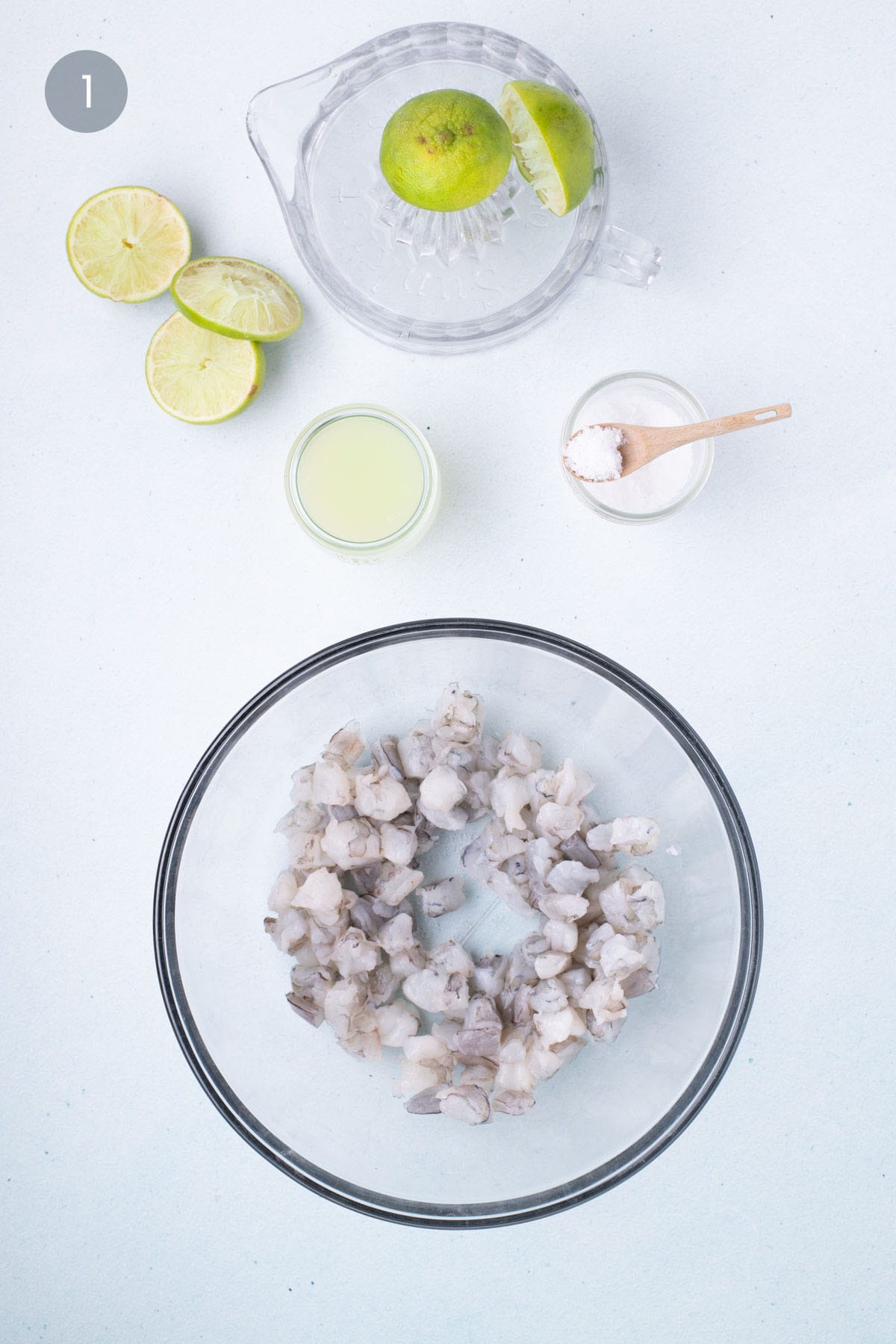 Raw shrimp marinating in fresh lime juice and salt