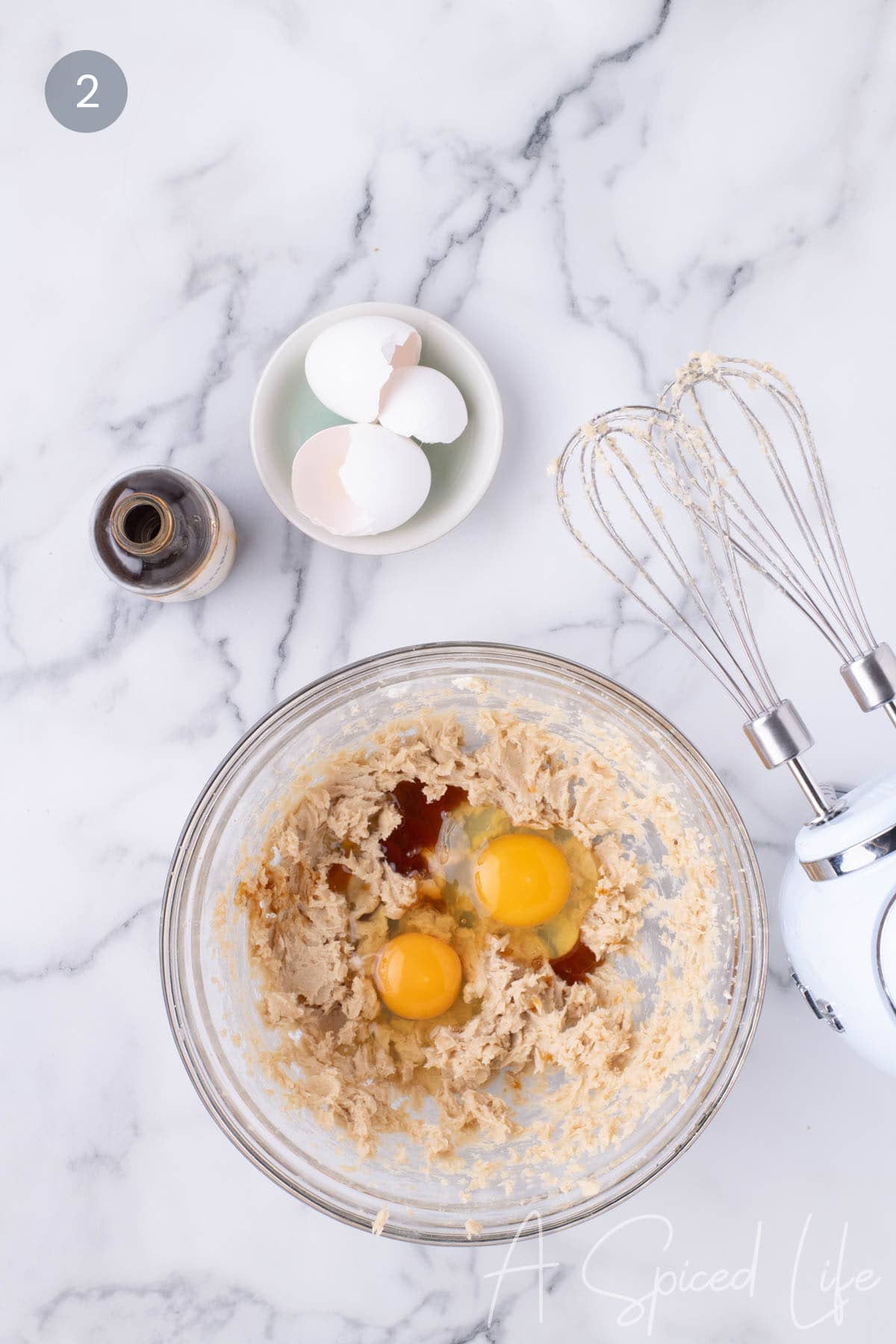 Step 2: Creaming the butter and brown and beating in the eggs and vanilla extract.