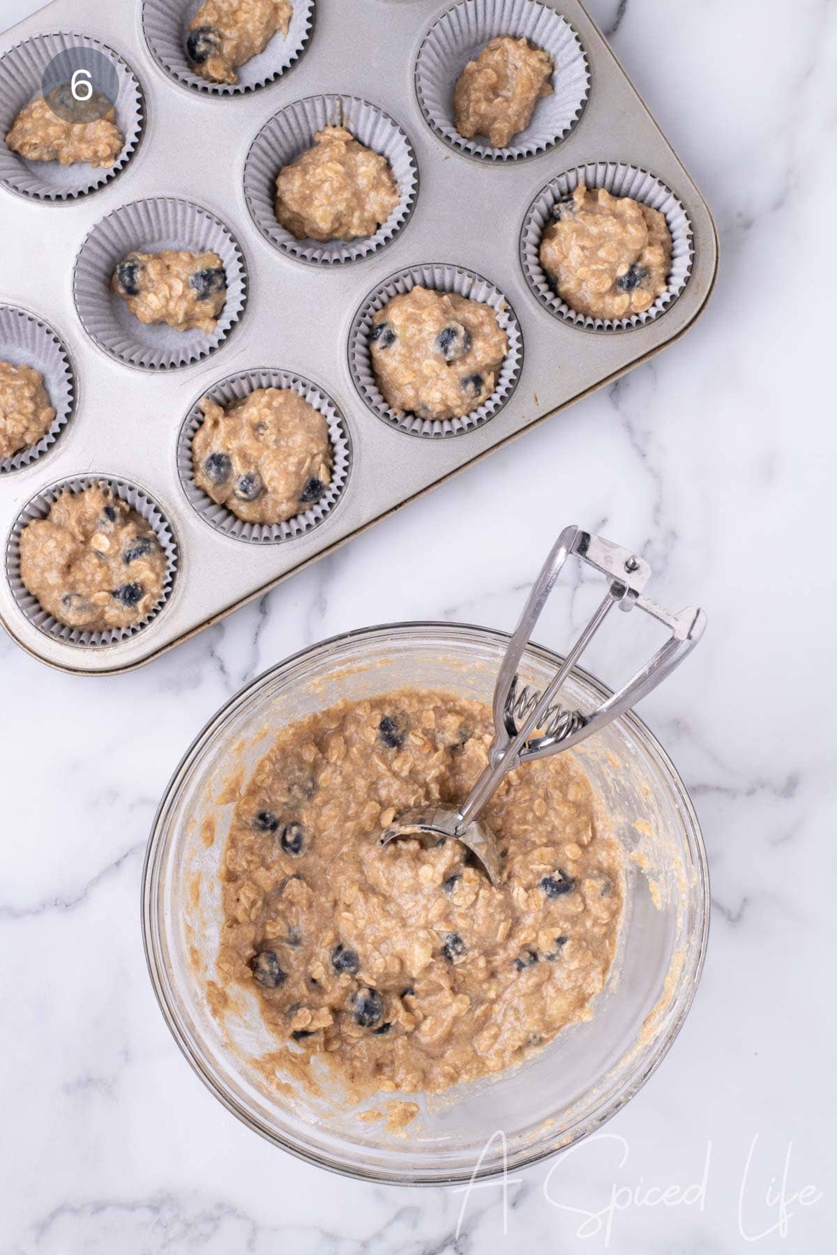 Step 6: Blueberries folded in and batter scooped into muffin liners