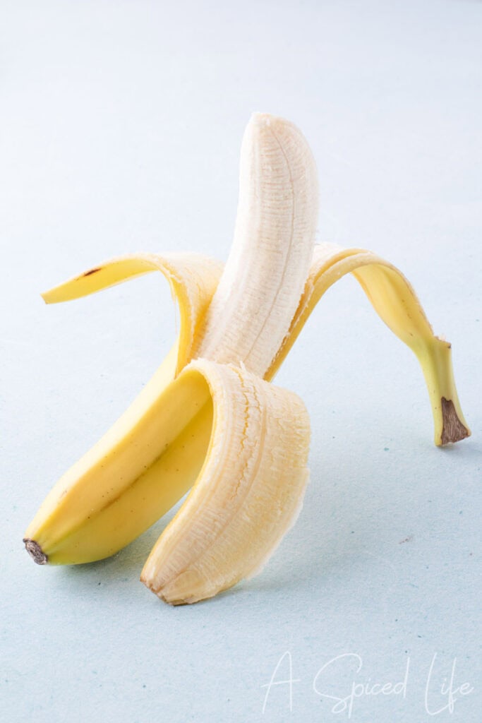 Close-up of a peeled banana with detailed texture