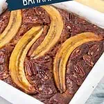 Banana bread loaf with pecan topping and whole caramelized bananas