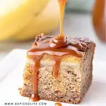 Spoon drizzling salted caramel over banana bread bar