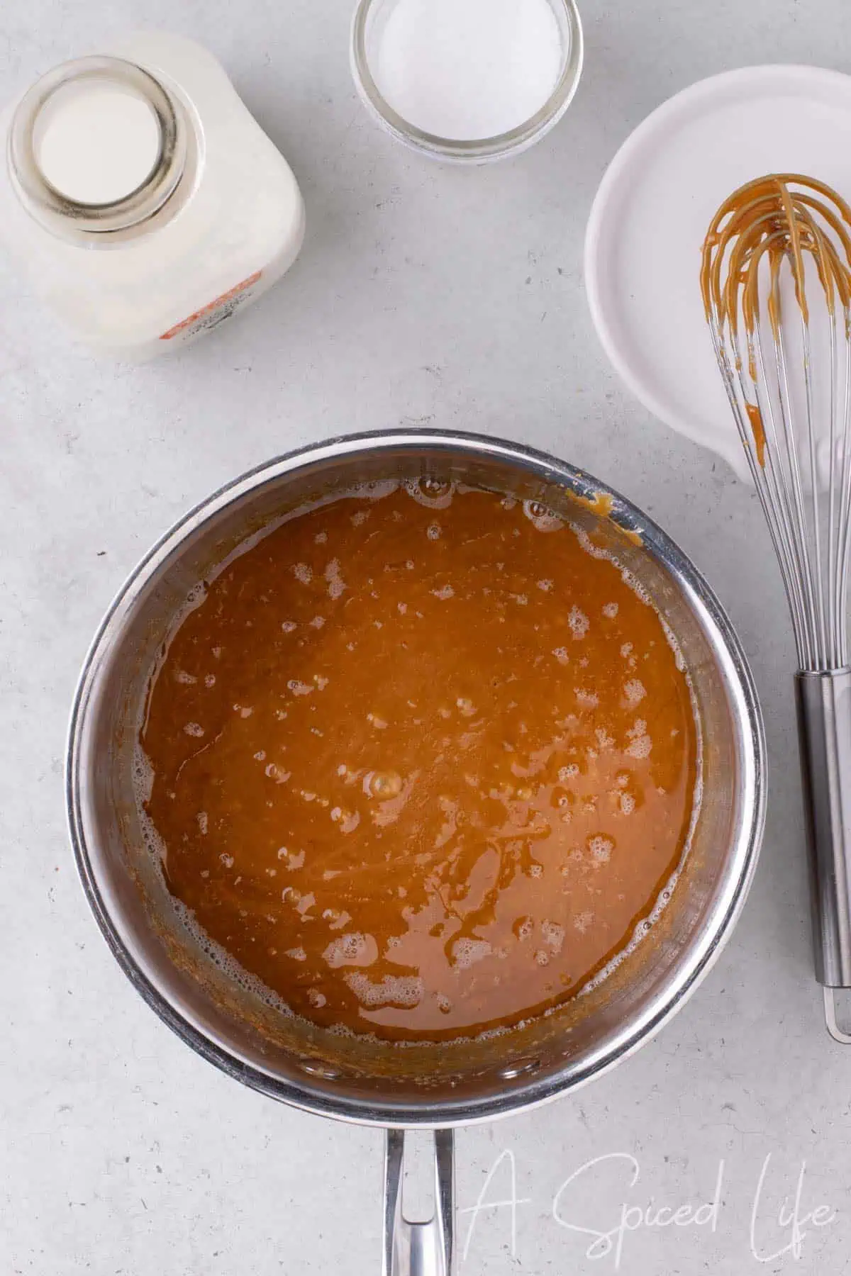 Cream about to be whisked into melted sugar and butter.