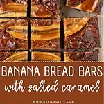 Banana bread bars cut into squares on parchment, with glossy caramel topping.