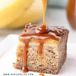 Close-up of caramel drizzle being poured over a banana bread bar.