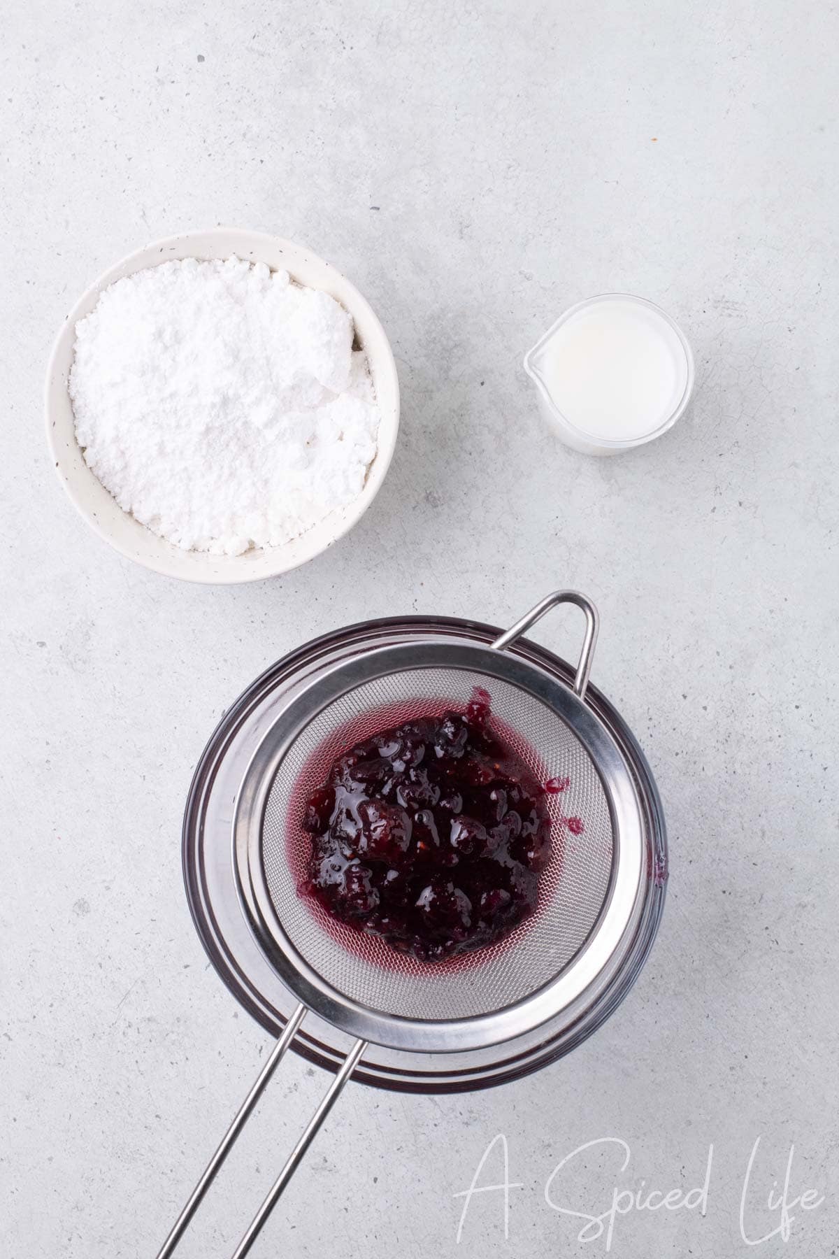 Blackberries cooked down and strained through a fine mesh sieve for glaze