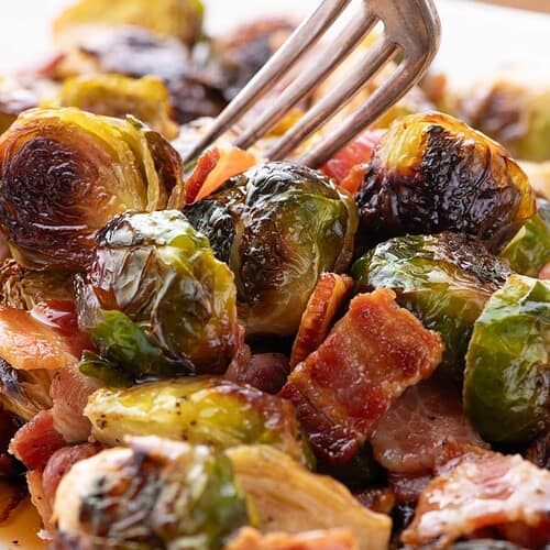 Brussels sprouts with bacon glistening with hot honey drizzle