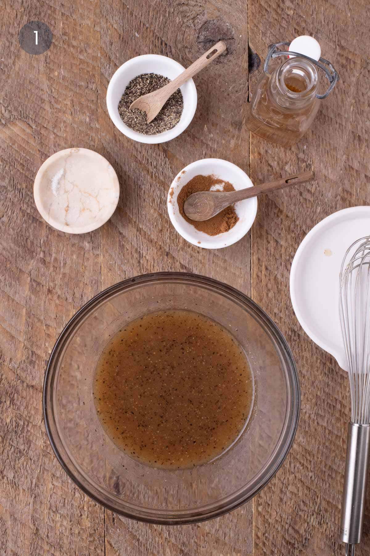 Bowl of melted butter and maple syrup whisked together with pumpkin spice