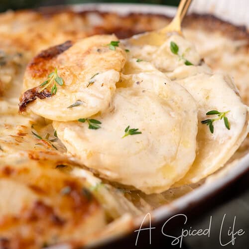 Golden, cheesy potatoes scooped from the baking dish