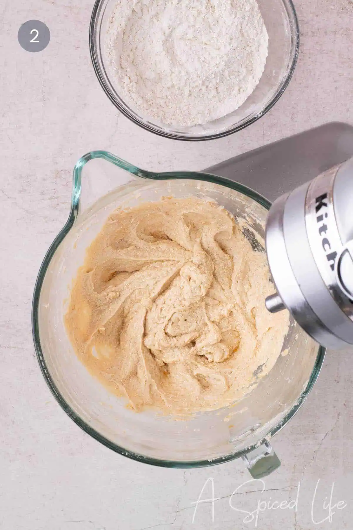 Mixing eggs and dry ingredients into cookie cake batter