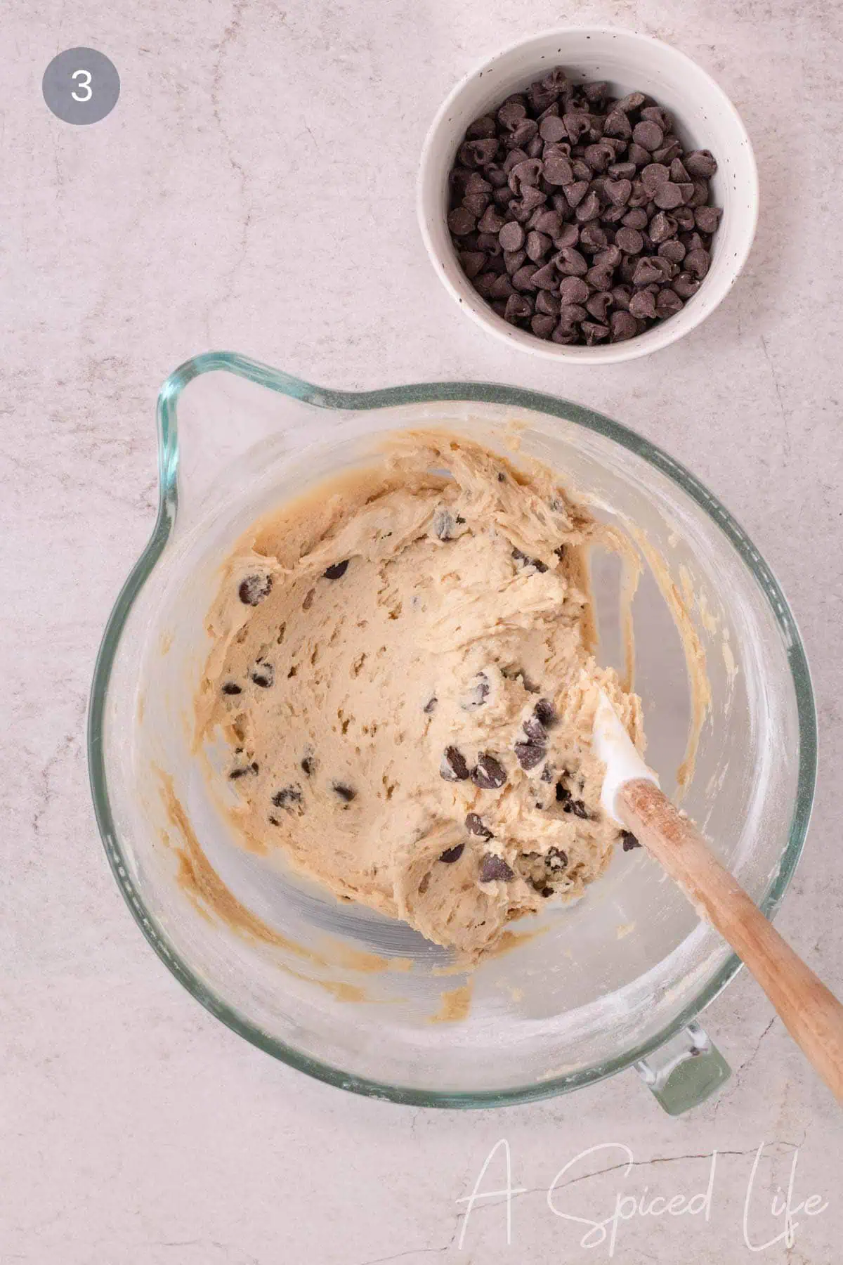 Chocolate chips folded into marshmallow chocolate chip cookie dough