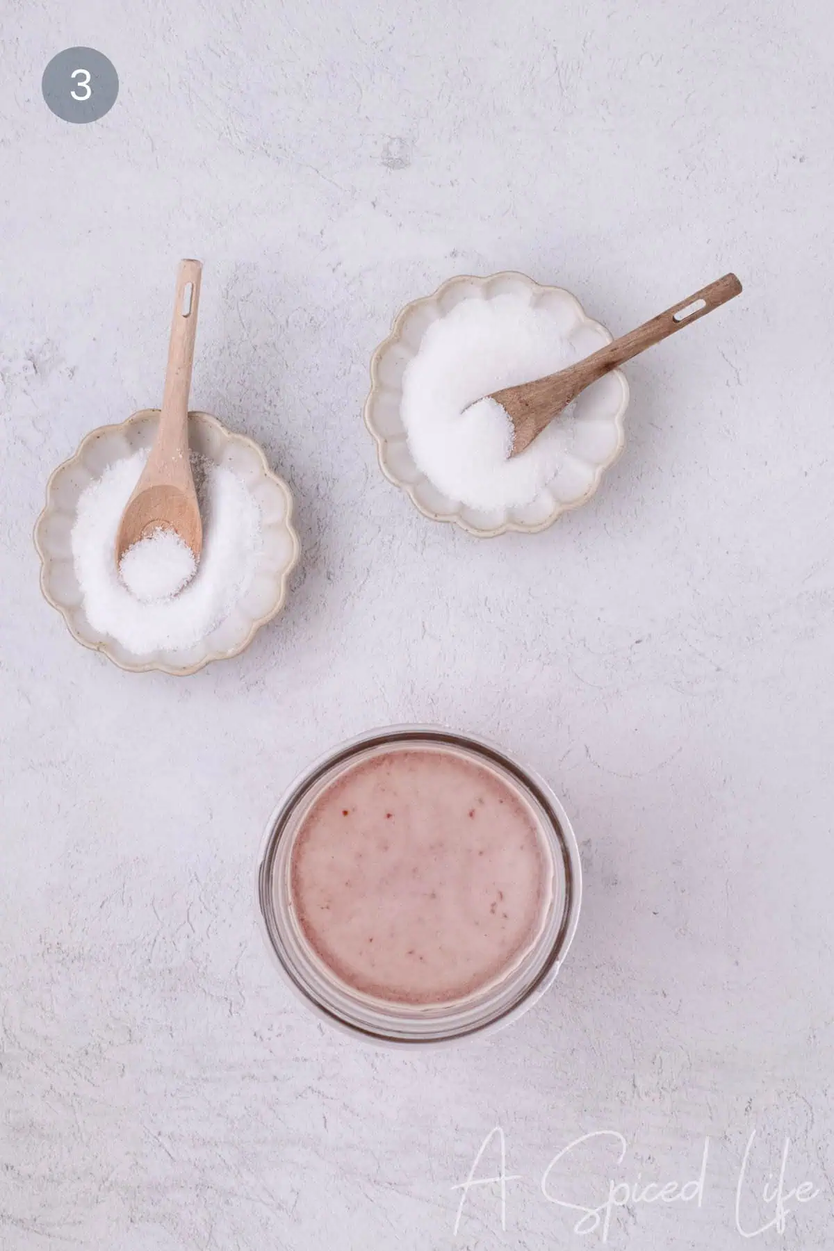 Salt and sugar added to vinegar mixture for pickling shallots