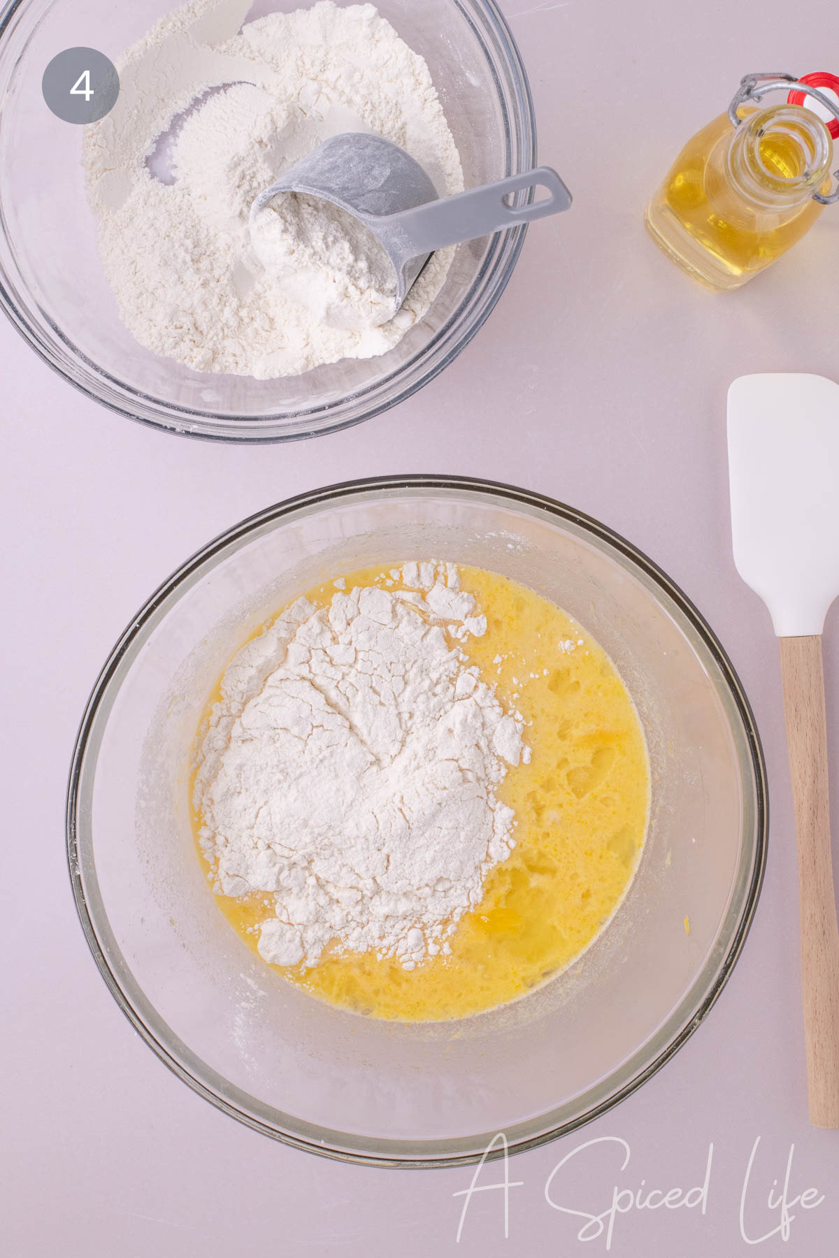 Dry ingredients being added to wet ingredients for lemon loaf batter