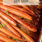 Roasted carrots coated in maple glaze with caramelized sauce on a serving plate.