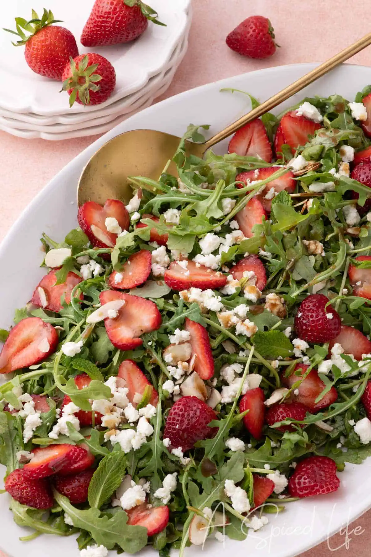 Goat cheese and strawberry salad with arugula, almonds, and balsamic vinaigrette