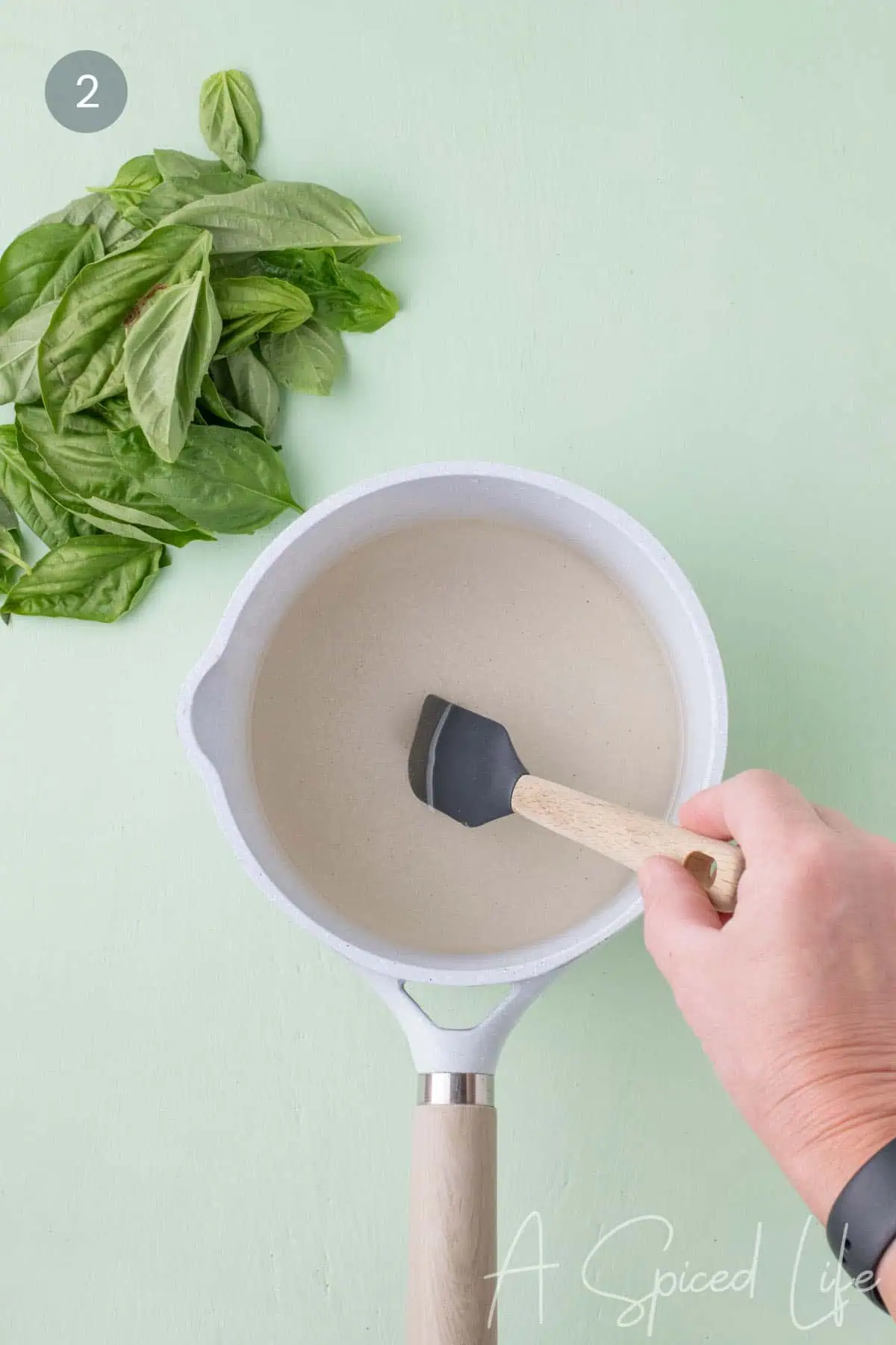 Stirring sugar and water in a saucepan until the mixture becomes clear