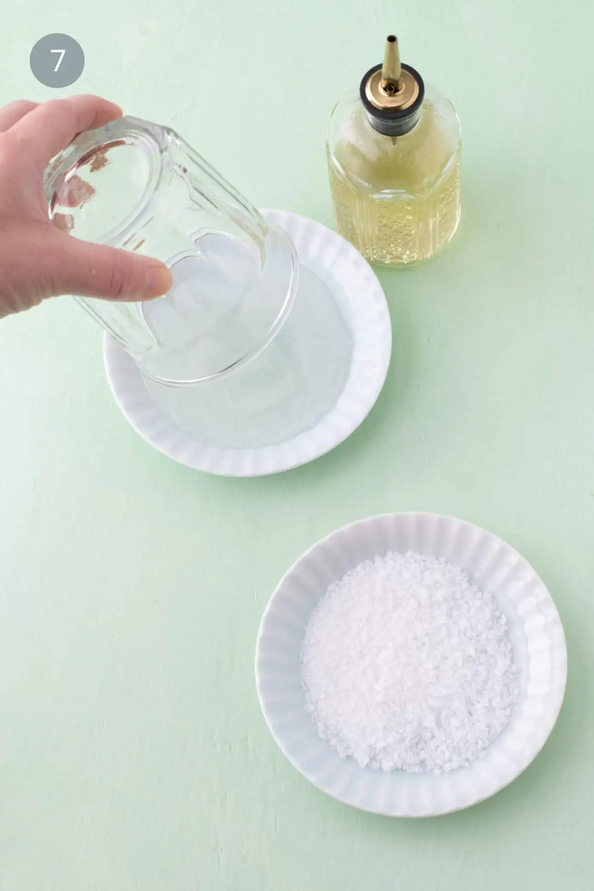 Dipping cocktail glass rim into simple syrup