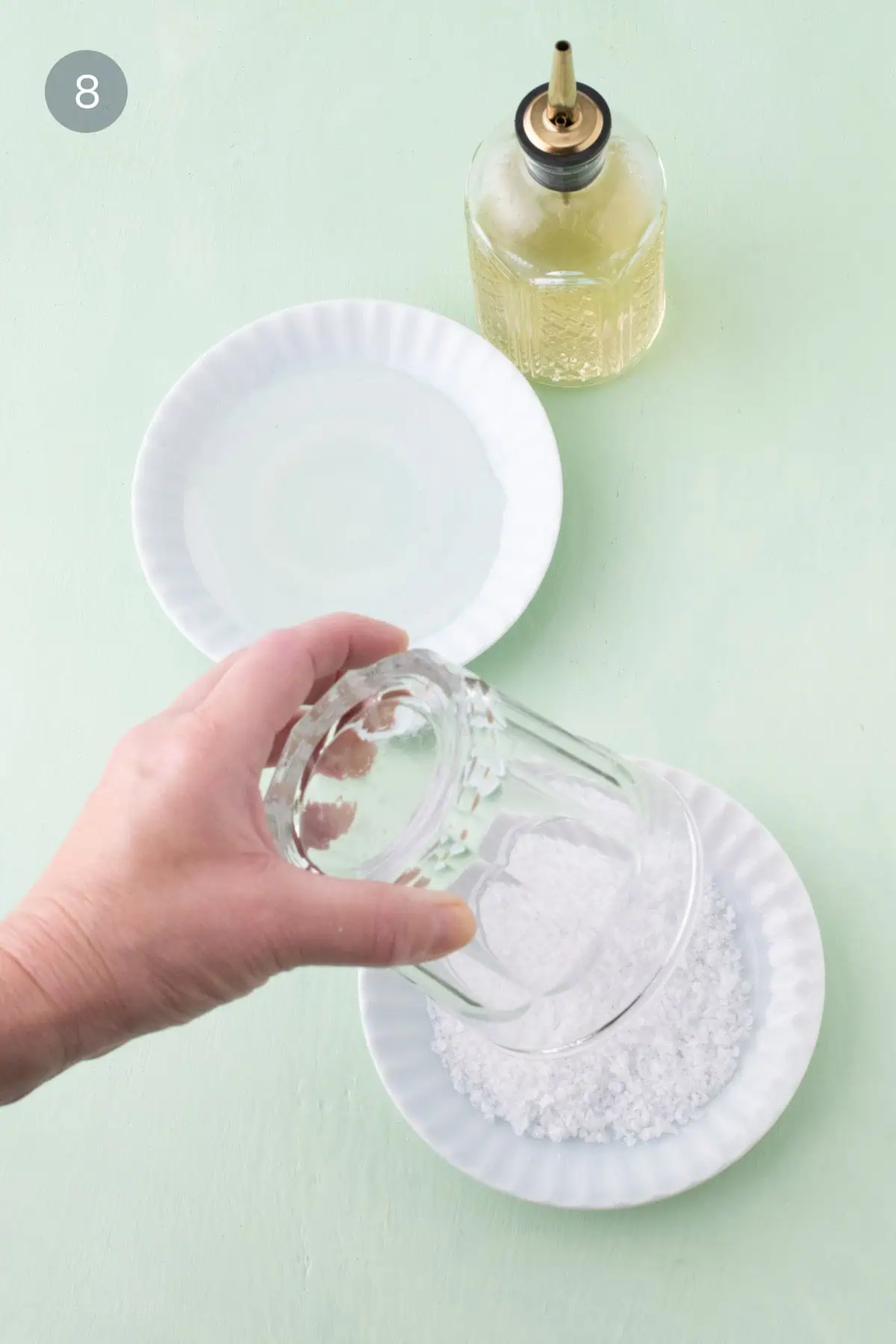 Pressing glass rim into coarse sanding sugar