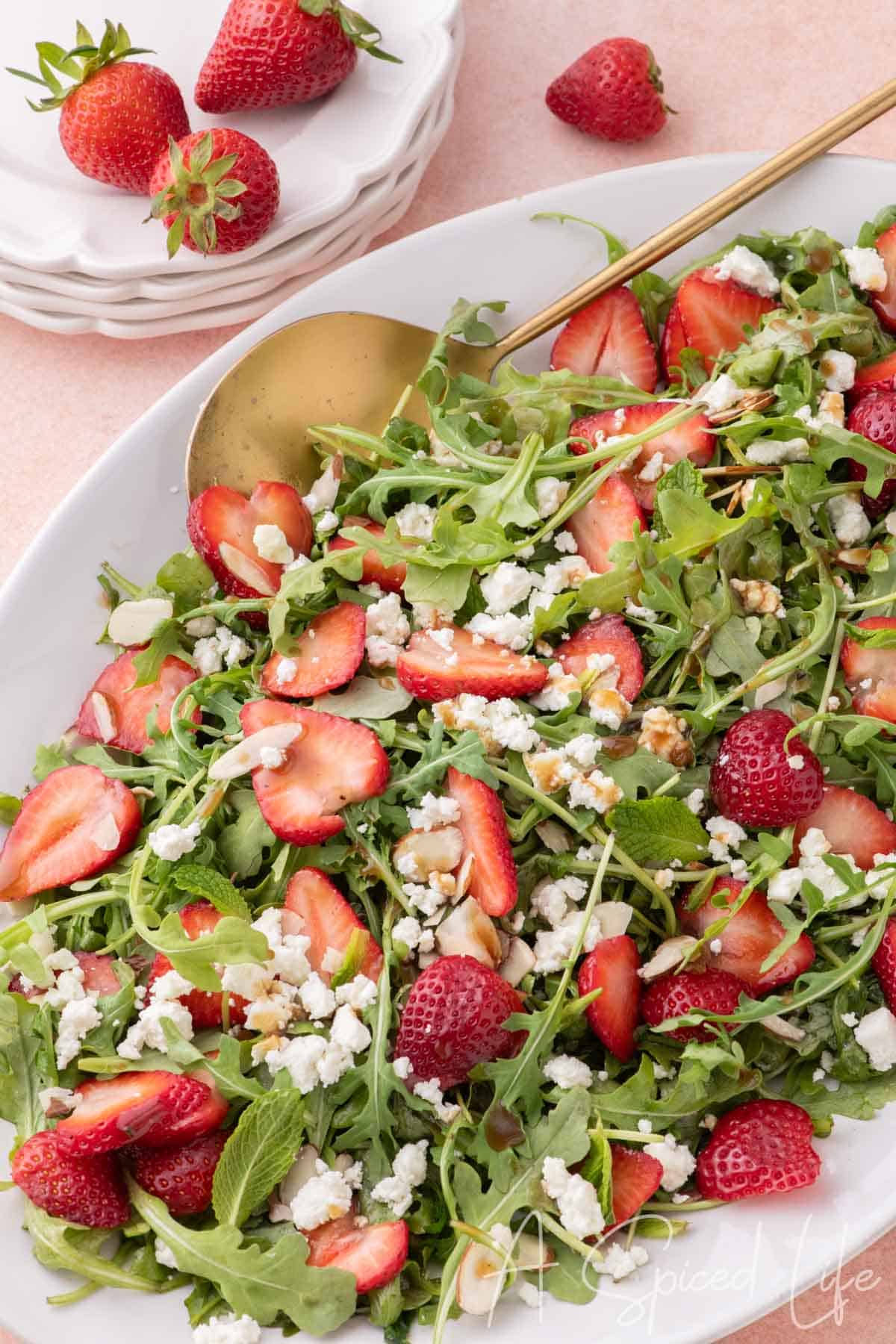 Goat cheese and strawberry salad with arugula, almonds, and balsamic vinaigrette