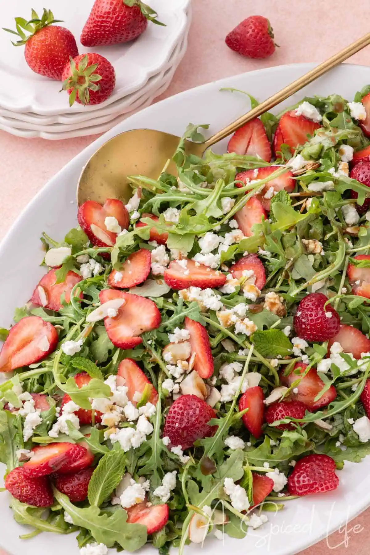 Goat cheese and strawberry salad with arugula, almonds, and balsamic vinaigrette