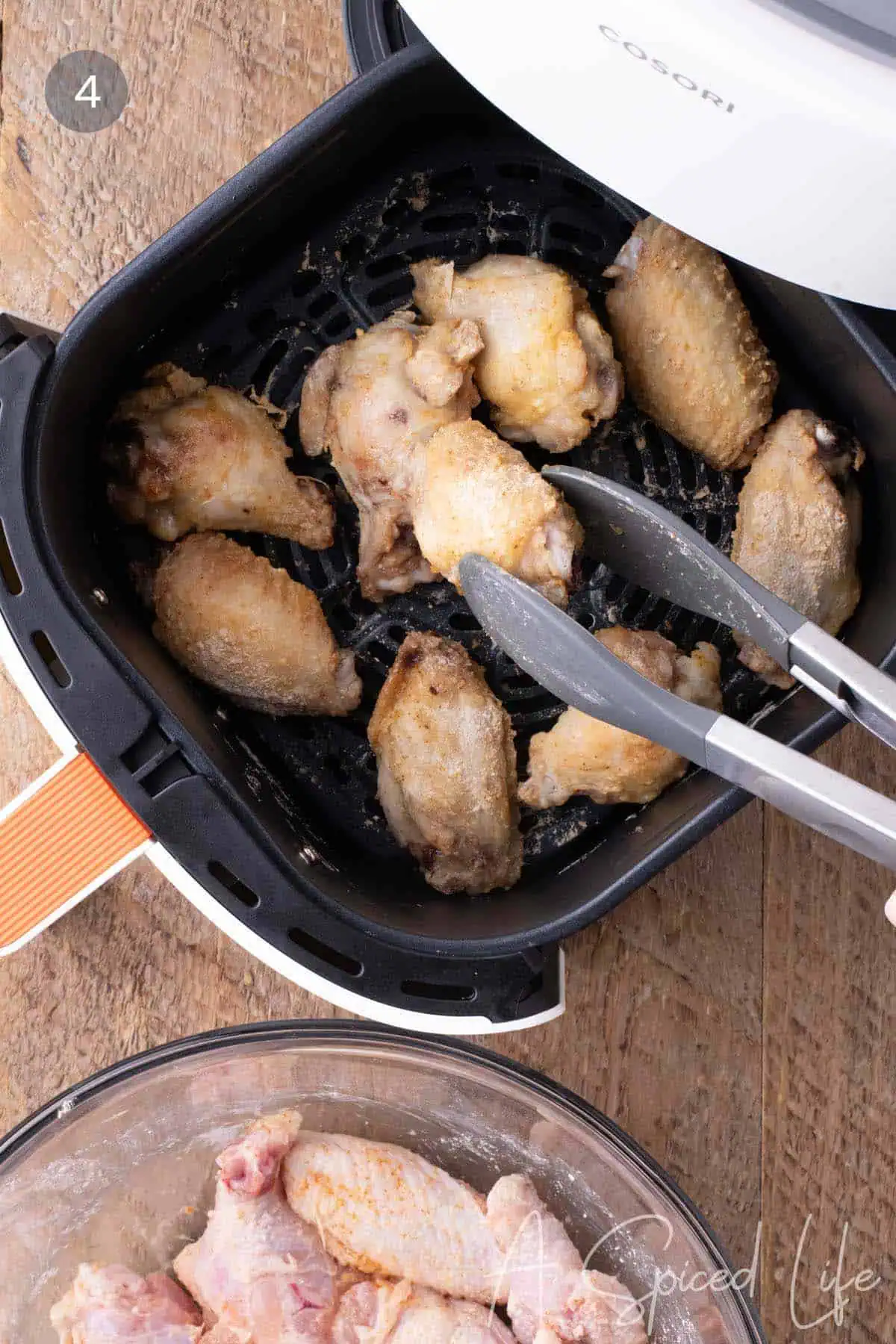 Crispy air fried chicken wings after cooking in the air fryer.