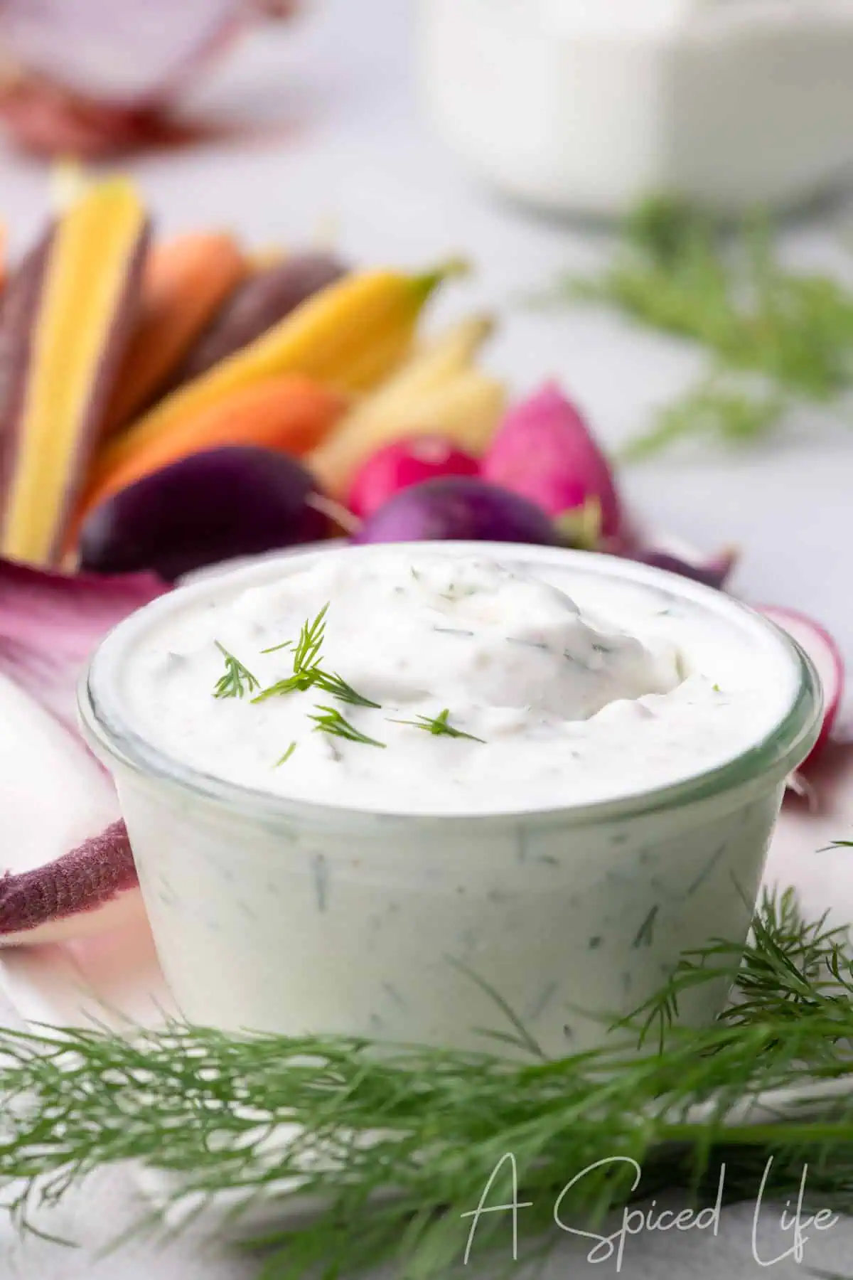 Thick dill Greek yogurt dip garnished with fresh dill