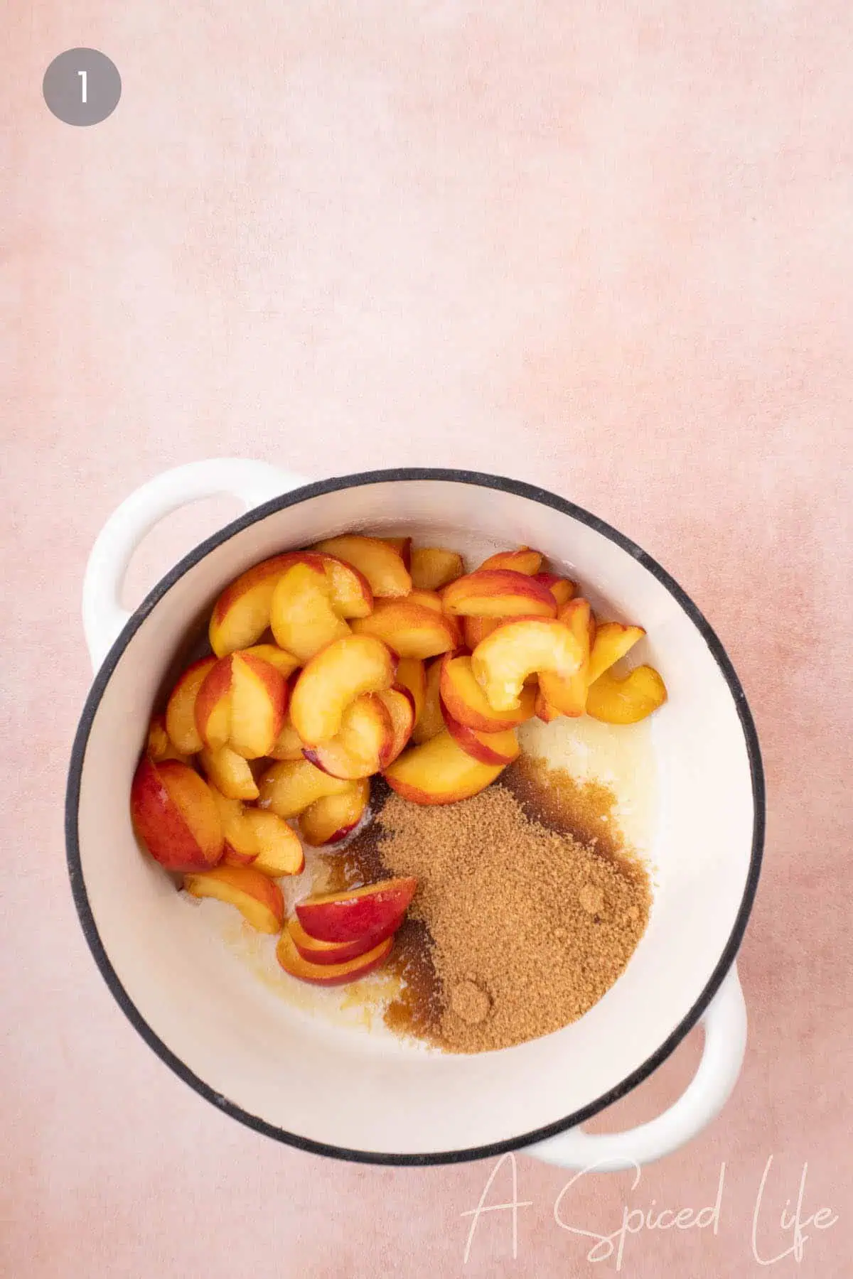 Cherry and peach cobbler peaches mixed with sugar and spices.