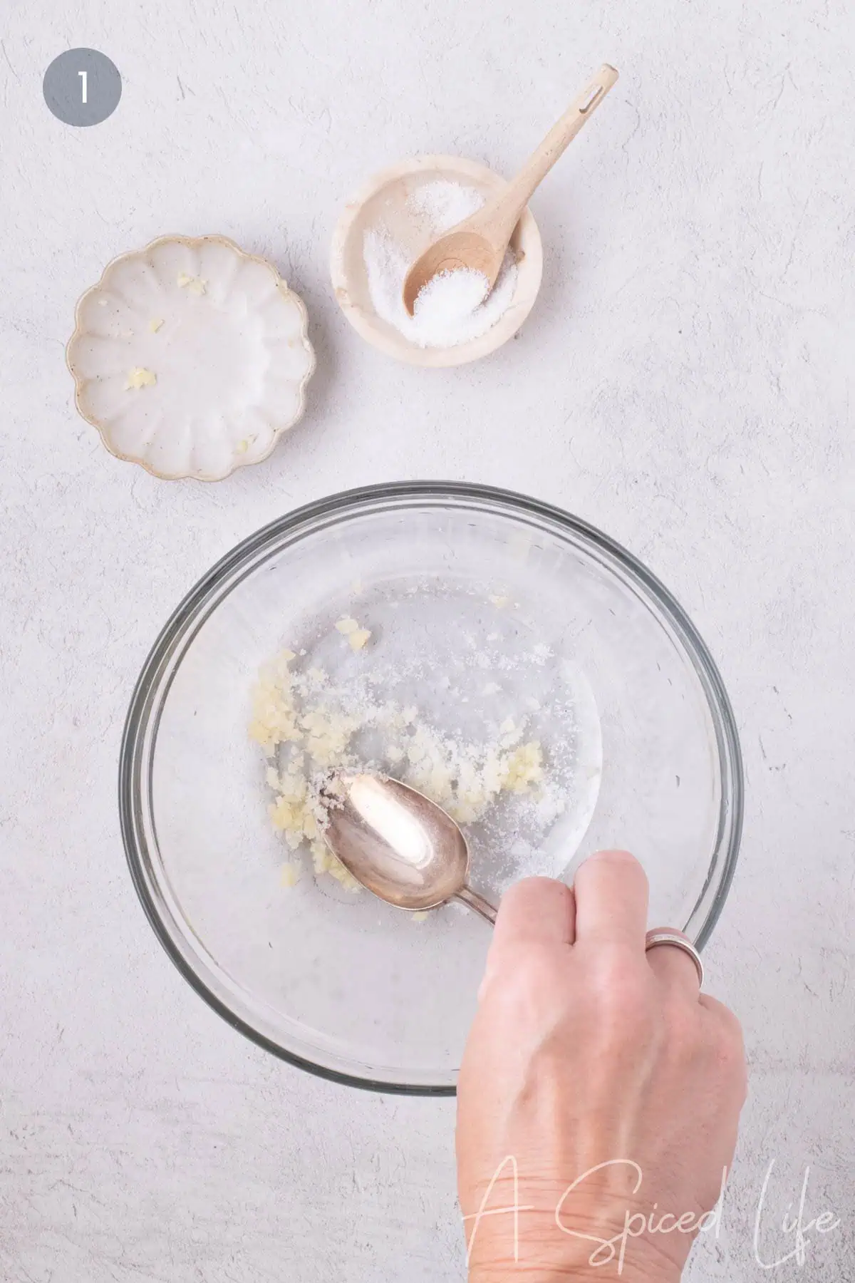 Minced garlic and kosher salt mashed together for a yogurt dip with dill