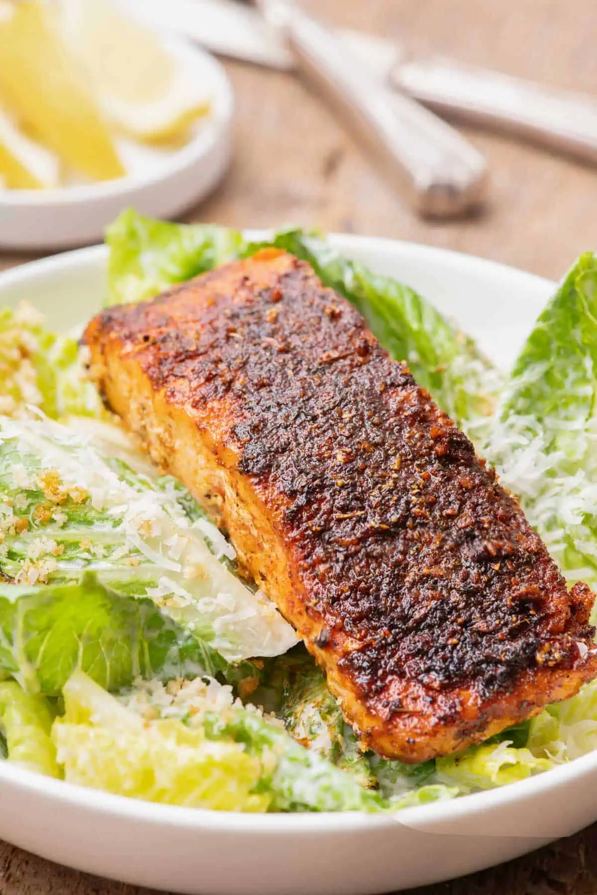 Blackened salmon served over romaine lettuce tossed with creamy Caesar dressing.