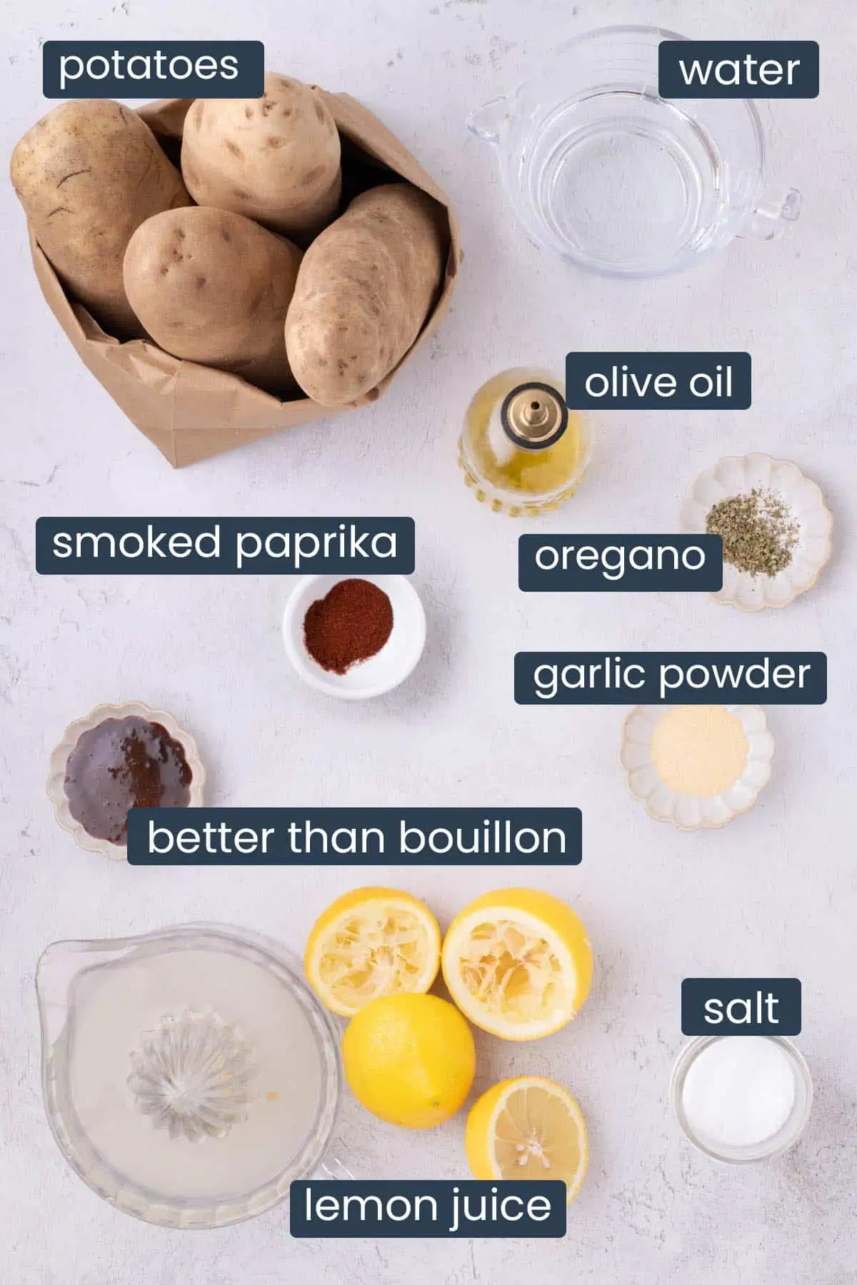 Ingredients for grilled potato slices, including Yukon Gold potatoes, broth, lemon juice, olive oil, oregano, garlic powder, smoked paprika, and salt.