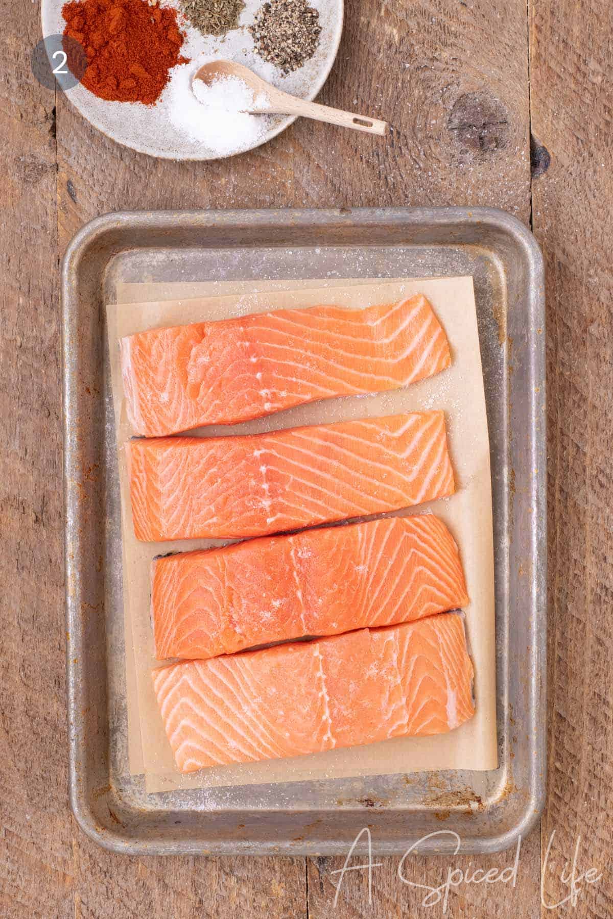 Atlantic salmon fillets lightly salted before cooking.