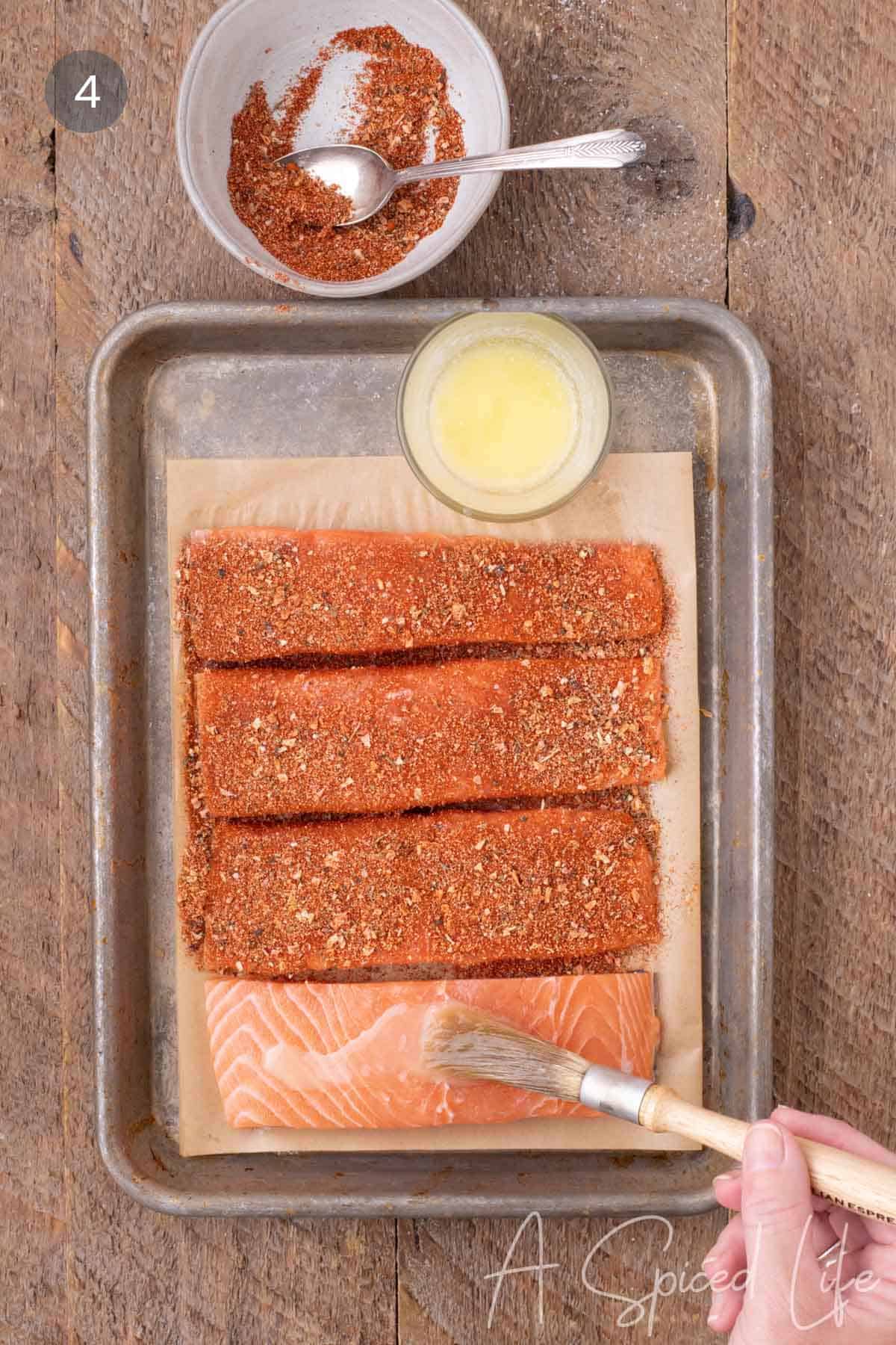 Salmon fillets coated with butter and a homemade blackened seasoning blend.