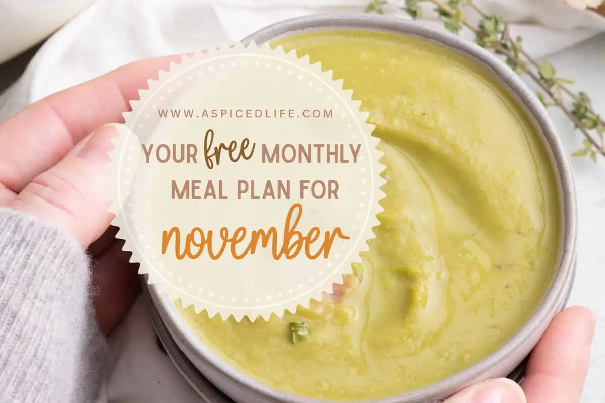 Hands holding a bowl of creamy split pea soup beneath a free November meal plan graphic